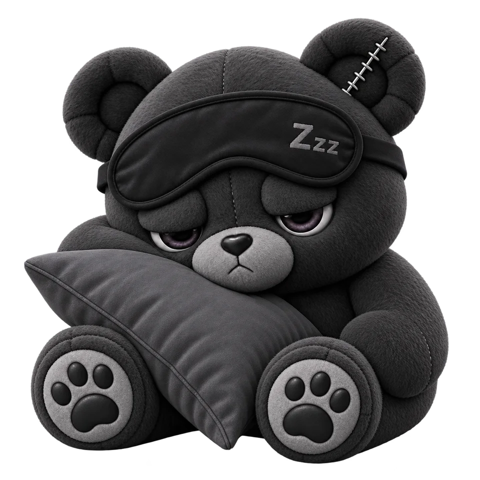 Snooze, a plush bear with a sleep mask marked Zzz pushed up on the forehead, hugging a grey pillow.